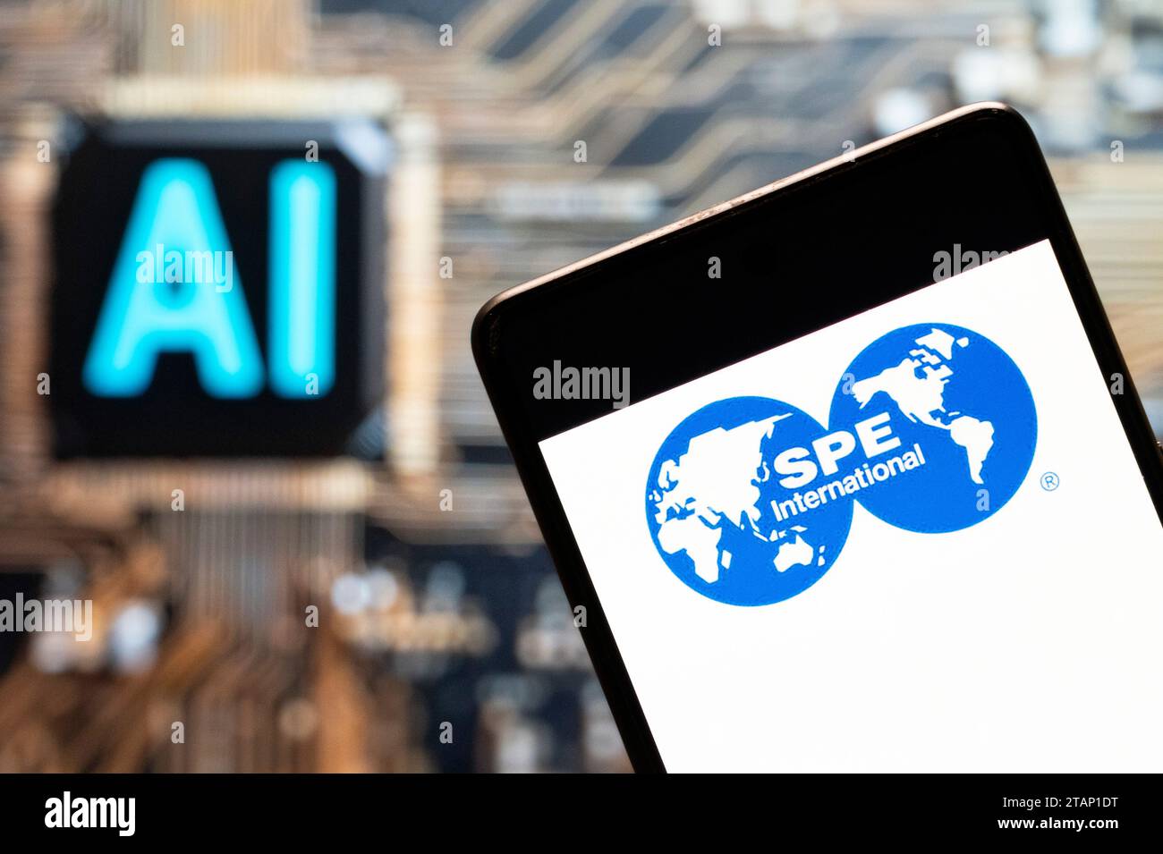 China. 03rd Nov, 2023. In this photo illustration, the Society of Petroleum Engineers (SPE) logo seen displayed on a smartphone with an Artificial intelligence (AI) chip and symbol in the background. (Photo by Budrul Chukrut/SOPA Images/Sipa USA) *** Strictly for editorial news purposes only *** Credit: Sipa USA/Alamy Live News Stock Photo