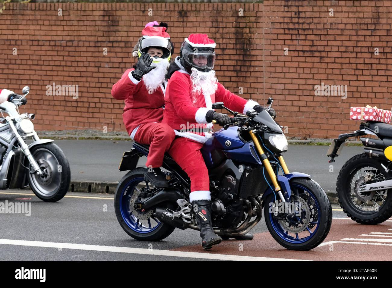 Bristol, UK. 2nd Dec, 2023. Santa's on a Bike is an annual charity ride out for motorcyclists. Starting from Winterbourne Academy they run through Bradley Stoke to Bristol on to their destination, Charlton Farm Children's Hospice. Any bike is permitted but Santa costume is a must. Credit: JMF News/Alamy Live News Stock Photo