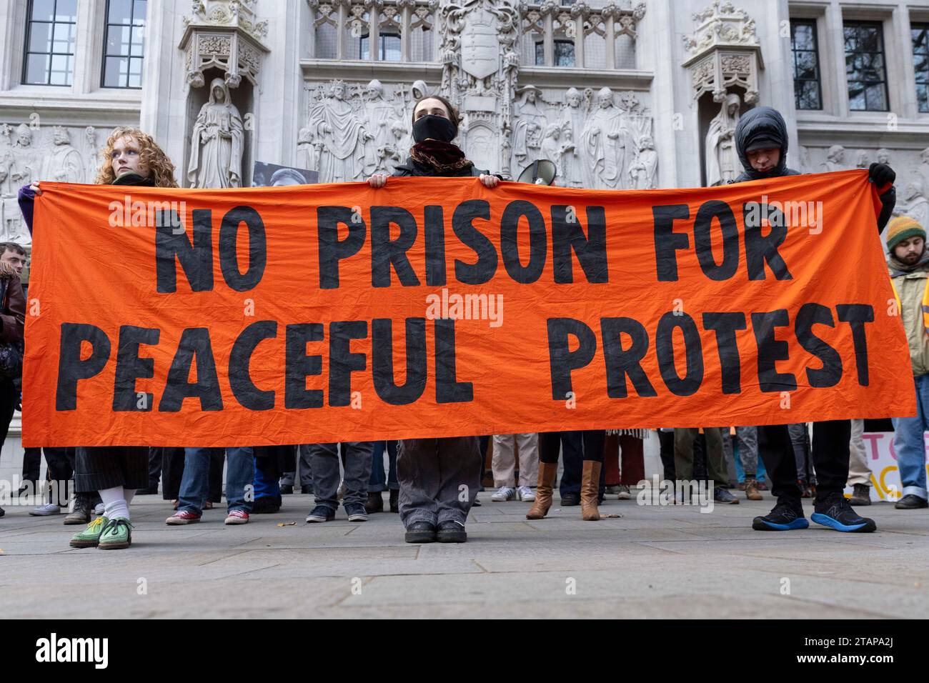 London, UK. 2nd Dec 2023. Just Stop Oil protesters march from New Scotland Yard to the Supreme Court. At least two climate activists were detained. Stock Photo
