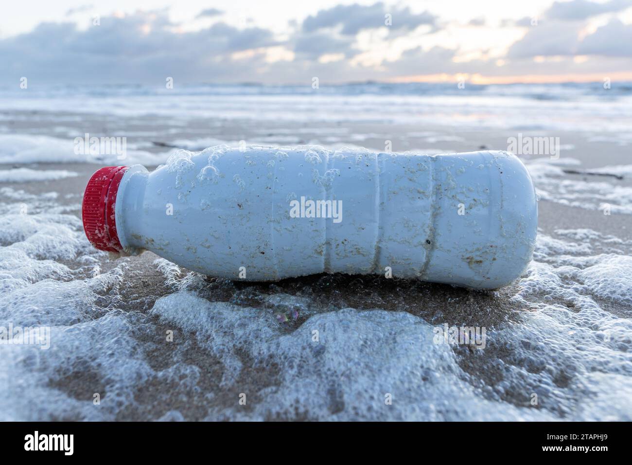 plastic waste on sandy beach Stock Photo