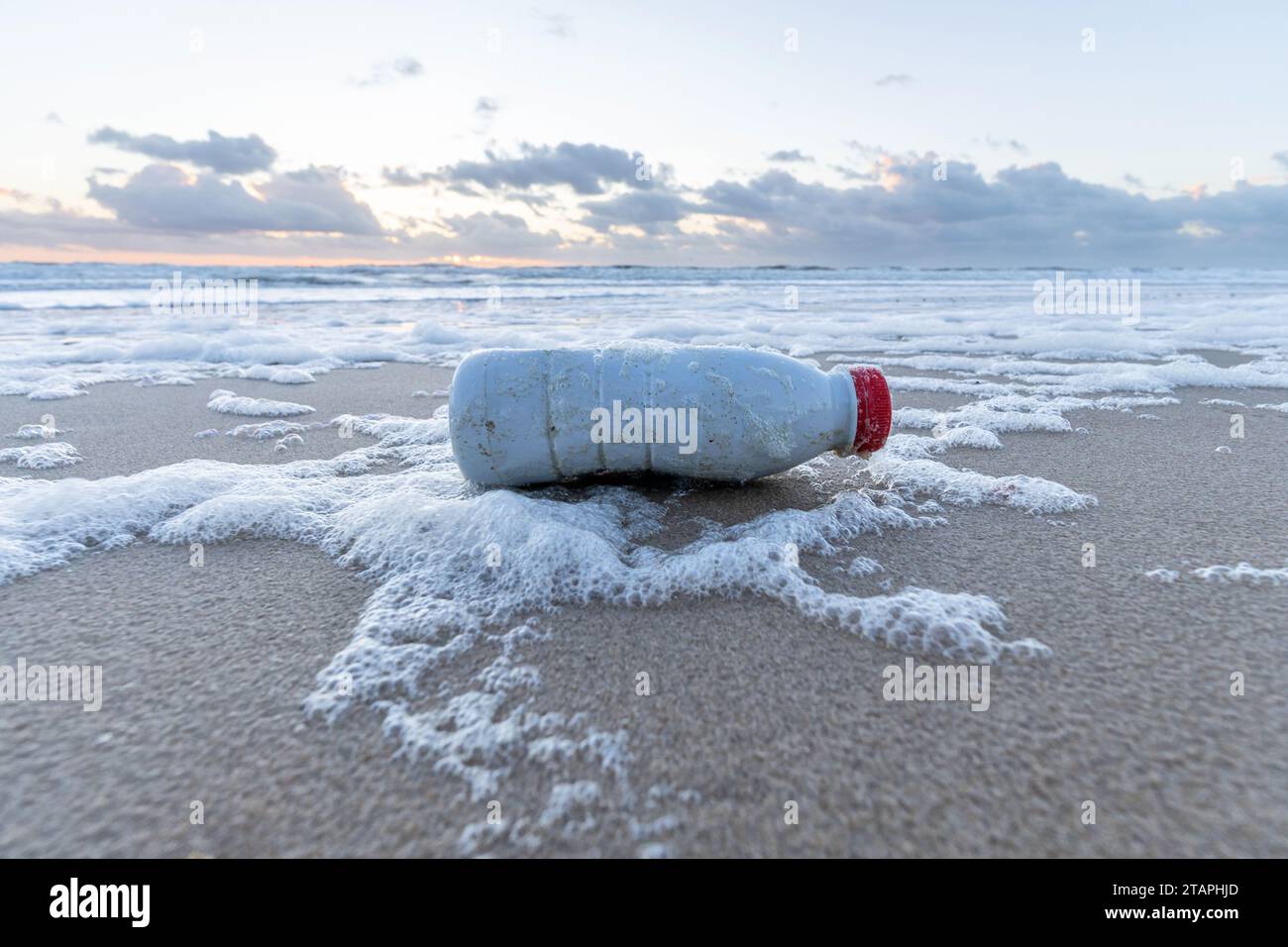 plastic waste on sandy beach Stock Photo