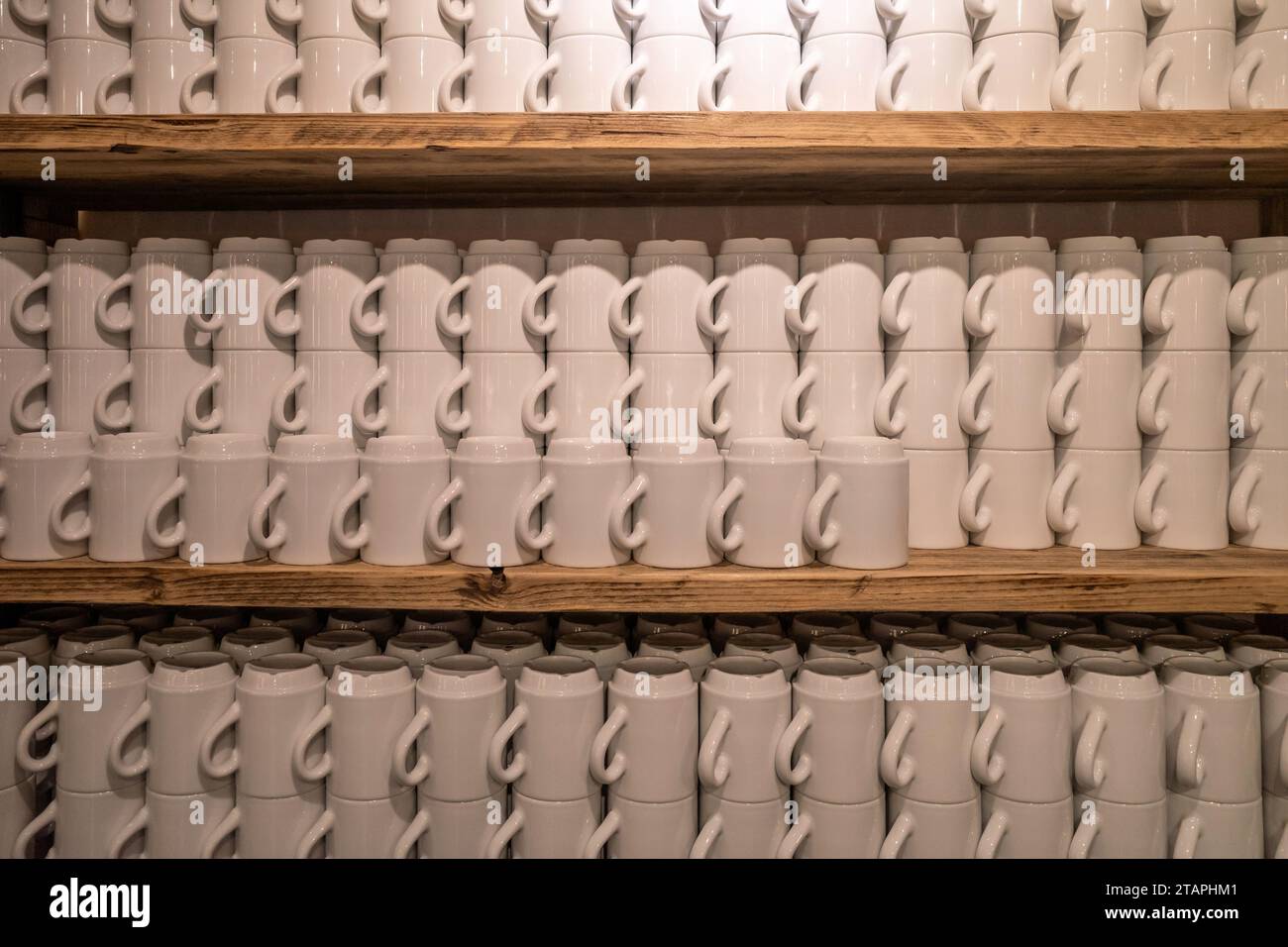 white coffee mugs on a shelf Stock Photo
