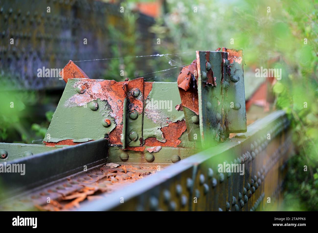 Rusted steel structure and peeling paint with nature in Linz Stock Photo