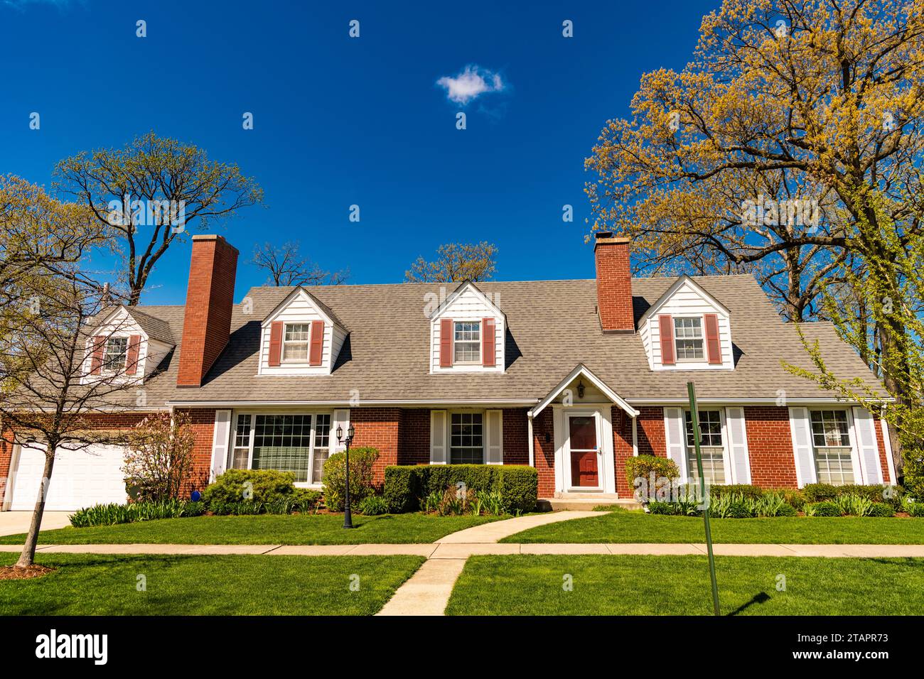 property in neighborhood. real estate and property insurance. property and architecture. housing. suburban house architecture. modern cottage house. a Stock Photo