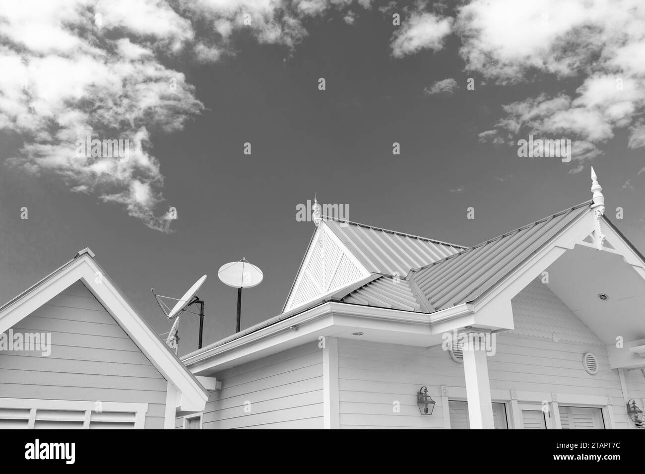 satellite on roof top. satellite on roof of house. satellite on roof on sky background. Stock Photo