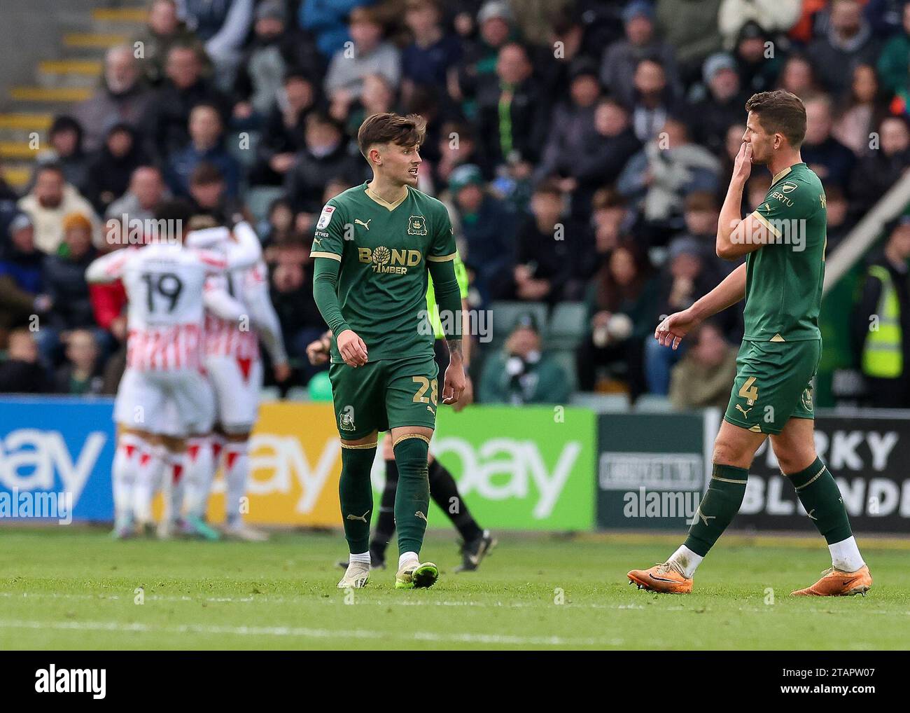 Luke Cundle #28 of Plymouth Argyle and Jordan Houghton #4 of Plymouth ...