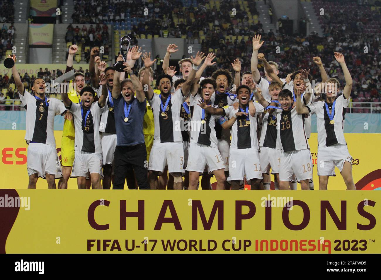 Surakarta, Central Java, Indonesia. 2nd Dec, 2023. German national team players lifts the FIFA U-17 World Cup winners trophy following victory in the FIFA U-17 World Cup Final match between Germany and France at Manahan Stadium. (Credit Image: © Angga Budhiyanto/ZUMA Press Wire) EDITORIAL USAGE ONLY! Not for Commercial USAGE! Stock Photo