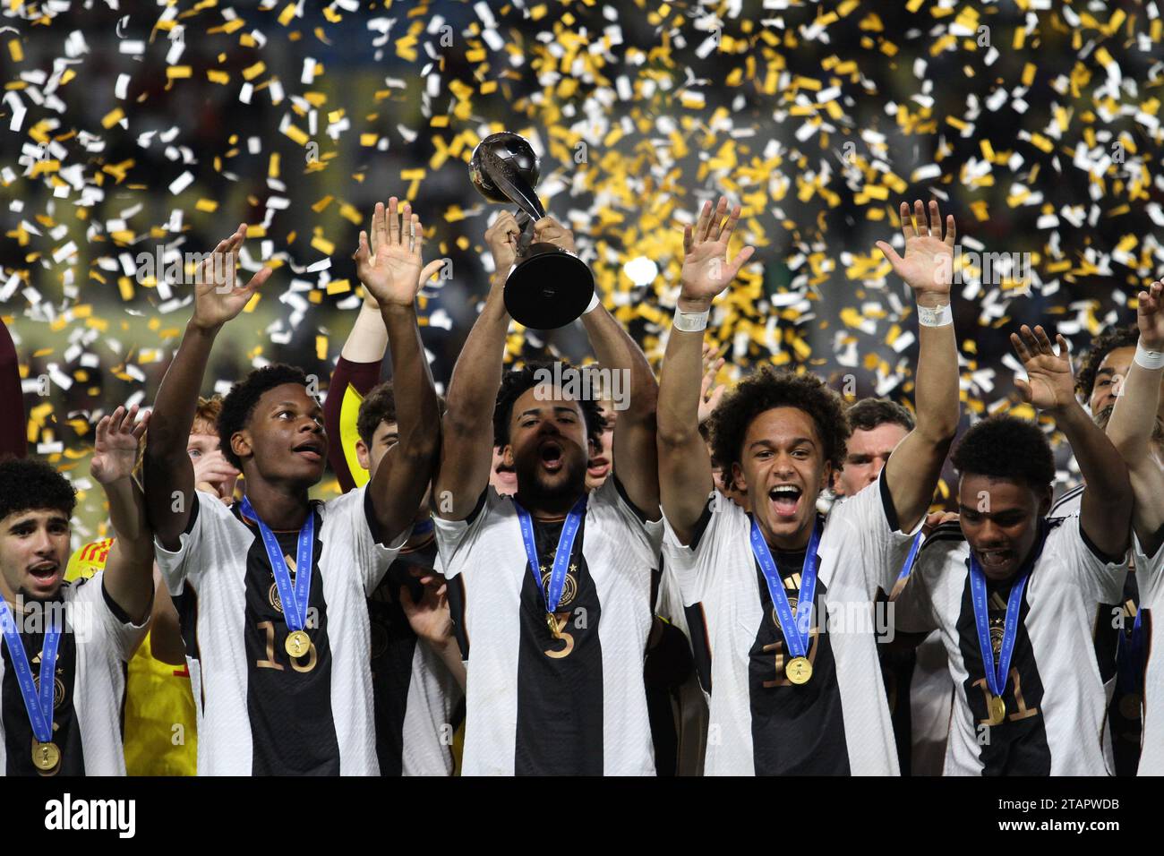 Surakarta, Central Java, Indonesia. 2nd Dec, 2023. German national team players lifts the FIFA U-17 World Cup winners trophy following victory in the FIFA U-17 World Cup Final match between Germany and France at Manahan Stadium. (Credit Image: © Angga Budhiyanto/ZUMA Press Wire) EDITORIAL USAGE ONLY! Not for Commercial USAGE! Stock Photo