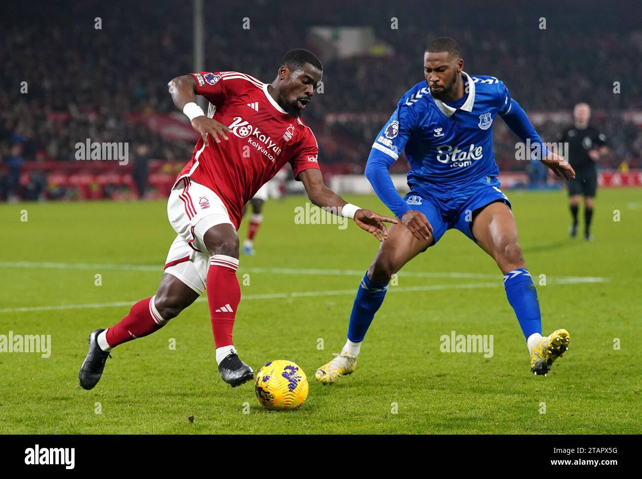Nottingham Forest's Serge Aurier (left) and Everton's Beto battle for the ball during the Premier League match at City Ground, Nottingham. Picture date: Saturday December 2, 2023. Stock Photo