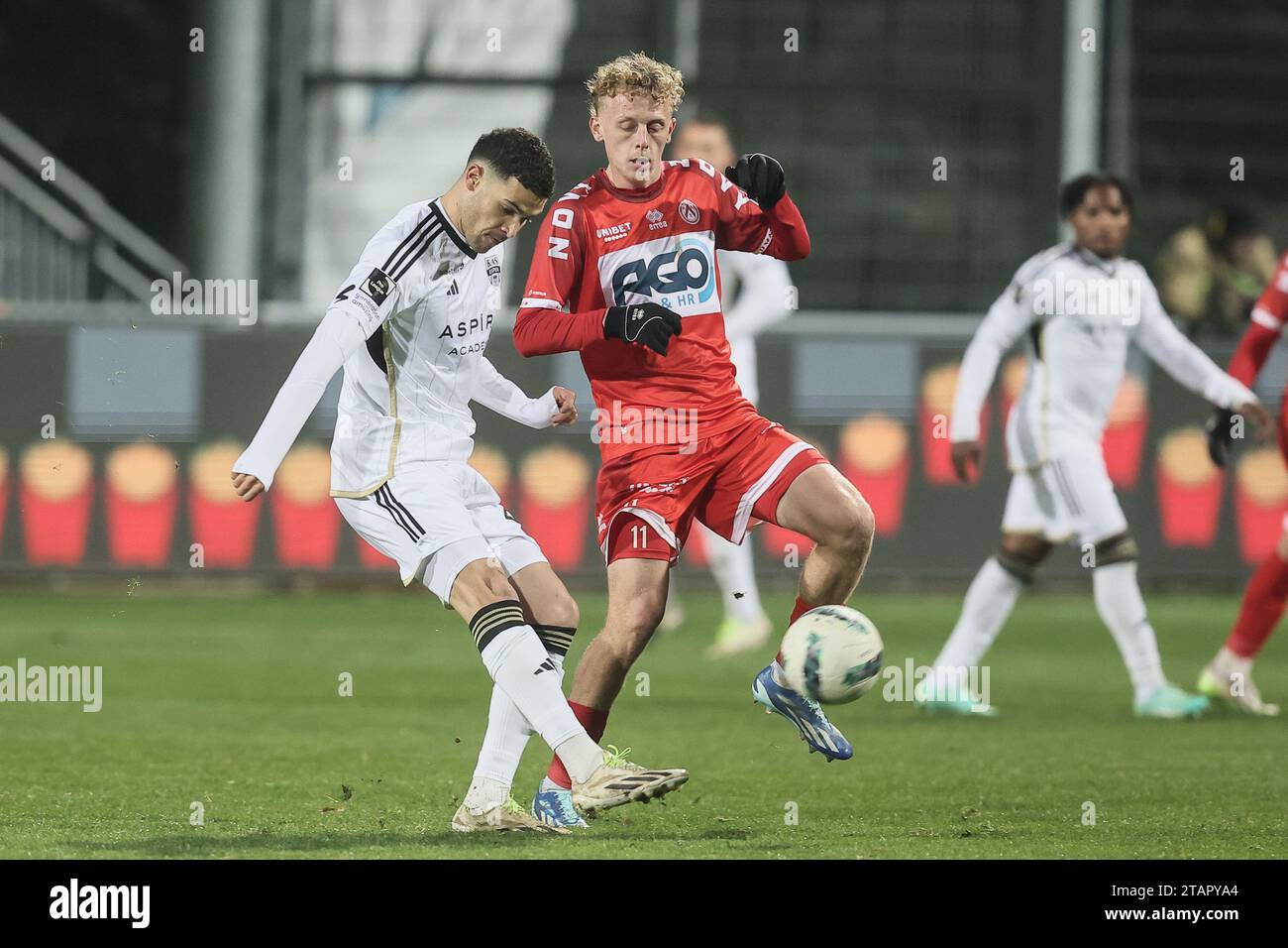 Eupen, Belgium. 02nd Dec, 2023. Eupen's Isaac Christie-Davies and Kortrijk's Dion De Neve fight for the ball during a soccer match between KAS Eupen and KV Kortrijk, Saturday 02 December 2023 in Eupen, on day 16/30 of the 2023-2024 'Jupiler Pro League' first division of the Belgian championship. BELGA PHOTO BRUNO FAHY Credit: Belga News Agency/Alamy Live News Stock Photo