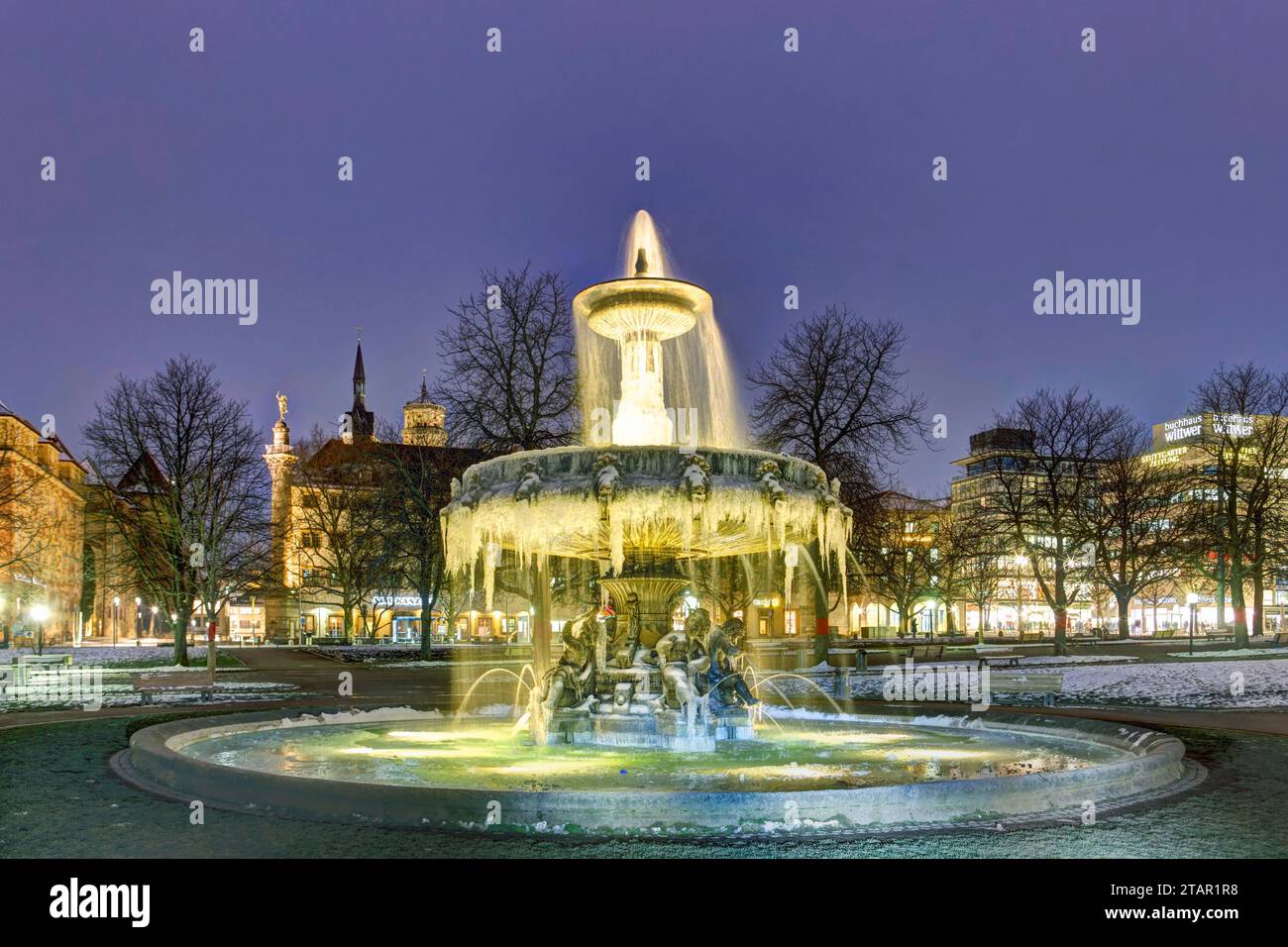 Fountain on Schlossplatz in winter, ice in the fountain bowls, evening shot, sight, Stuttgart, Baden-Wuerttemberg, Germany Stock Photo