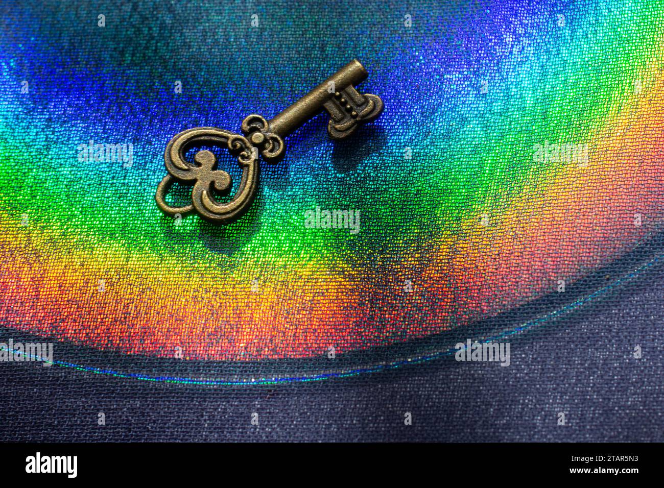 Vintage key. .Antique key. Retro key on colorful fabric background Stock Photo