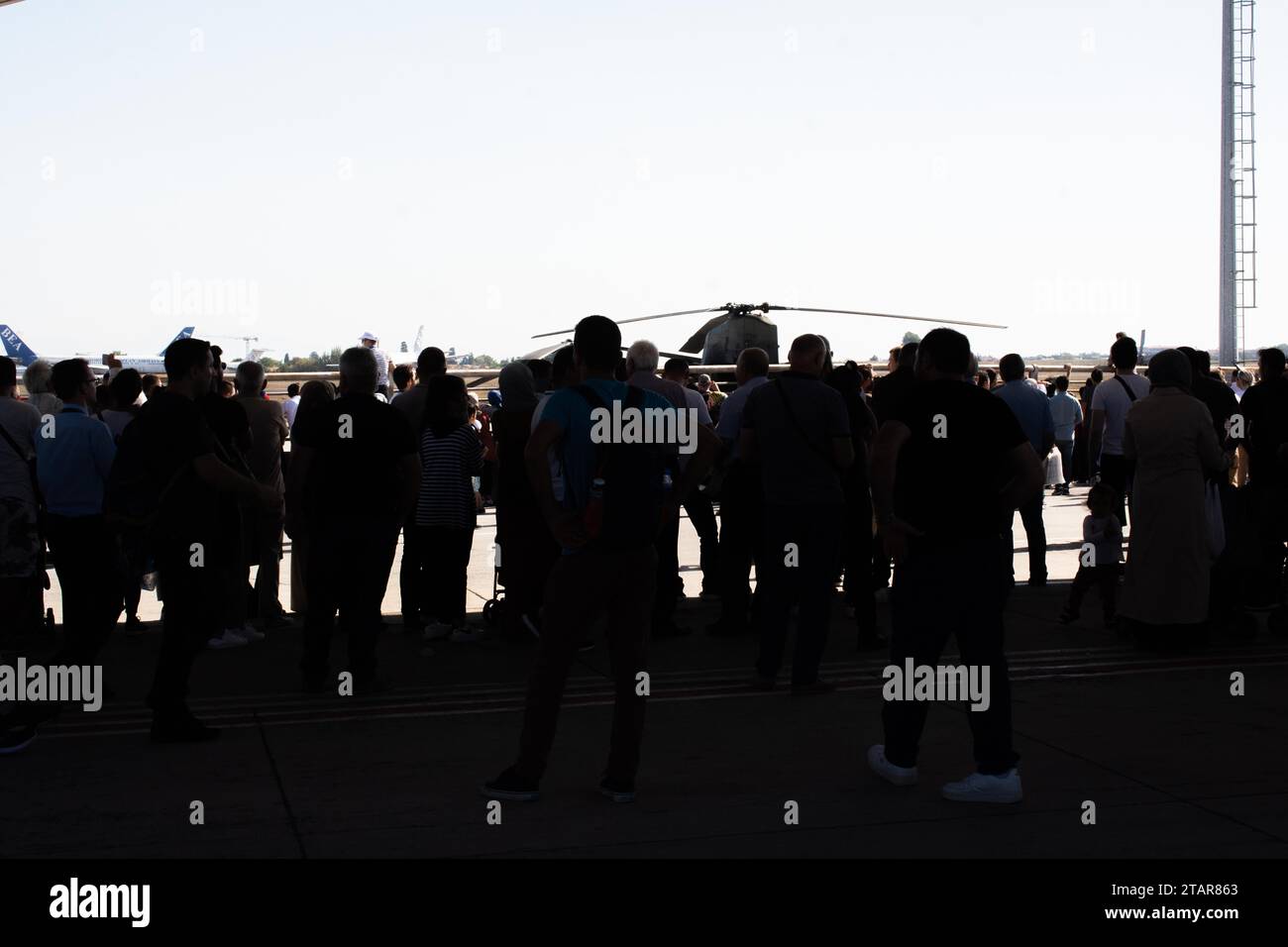Crowd of people silhouette. A lot of walking people Stock Photo