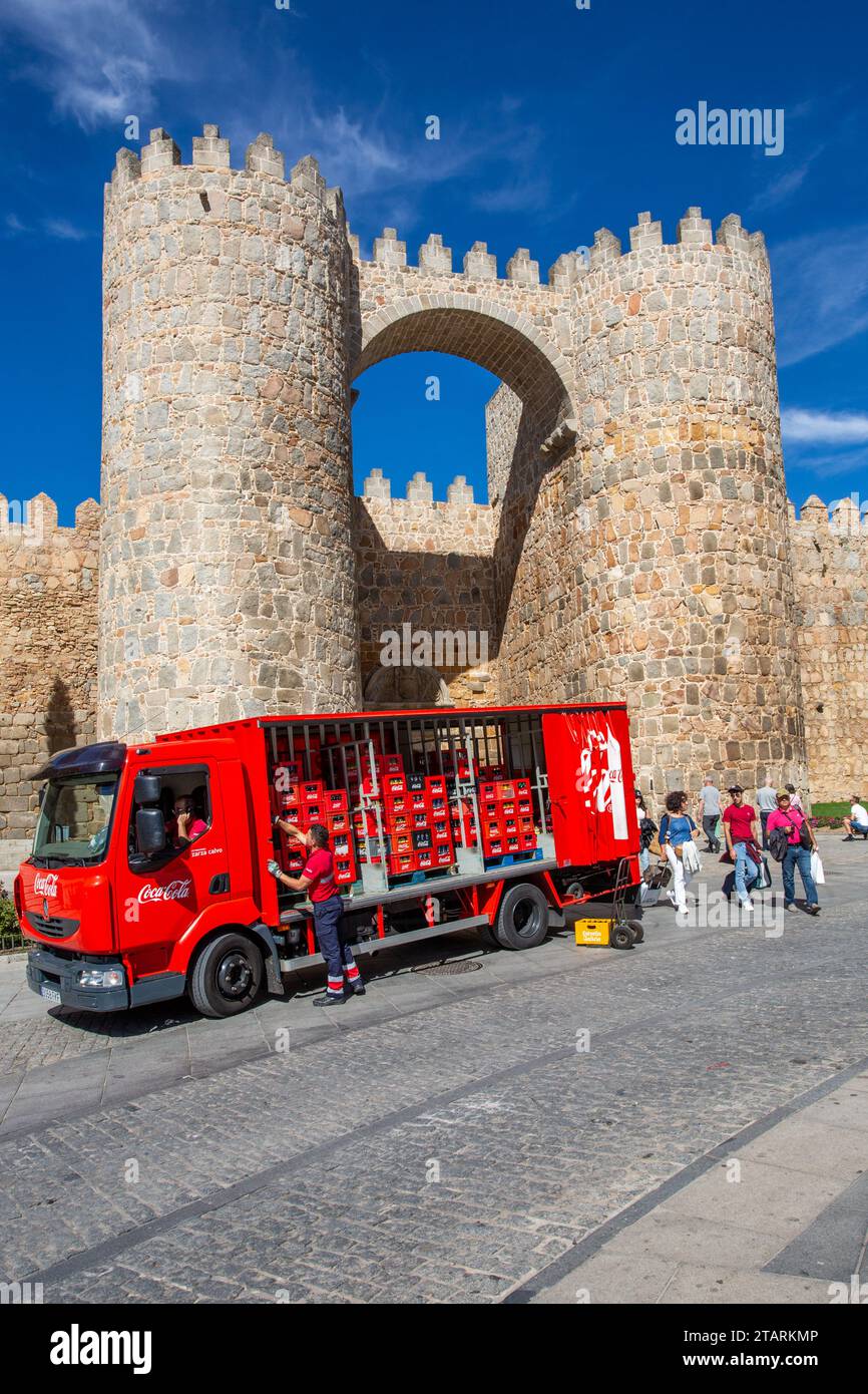 Coca Cola wagon making deliveries by the ramparts and fortifications in the Spanish walled city of  Avila Spain Stock Photo
