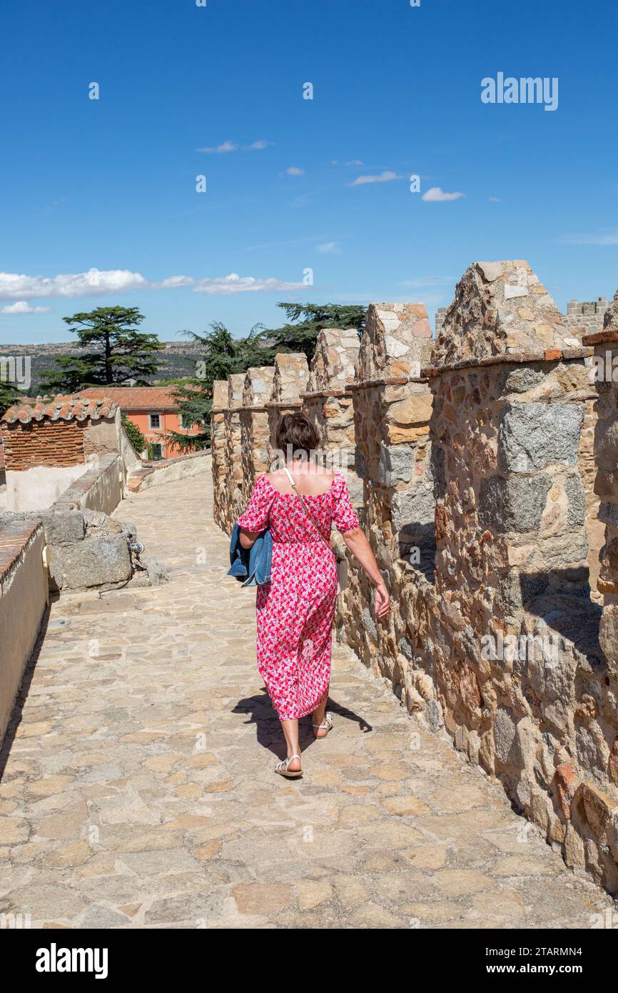 Woman walking on the ramparts of the fortified city walls in the