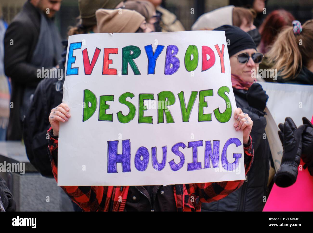 'Everybody deserves Housing' sign at protest to demand actions to help in the ongoing housing crisis Stock Photo