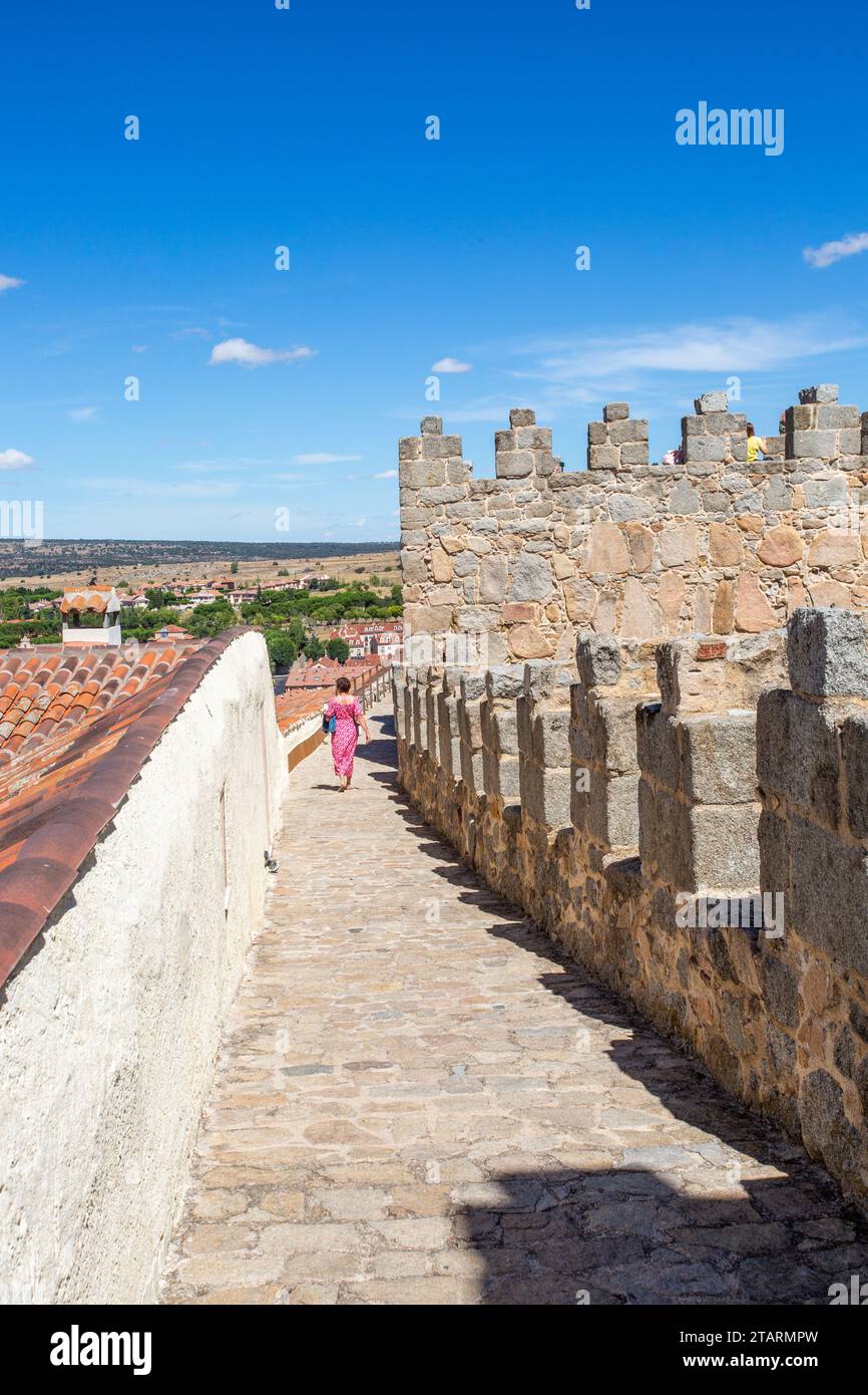 Woman walking on the ramparts of the fortified city walls in the
