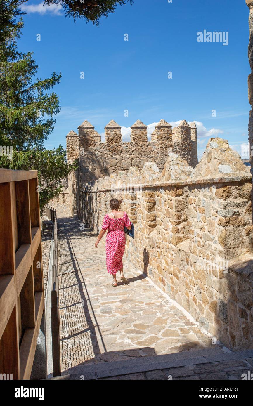 Woman walking on the ramparts of the fortified city walls in the