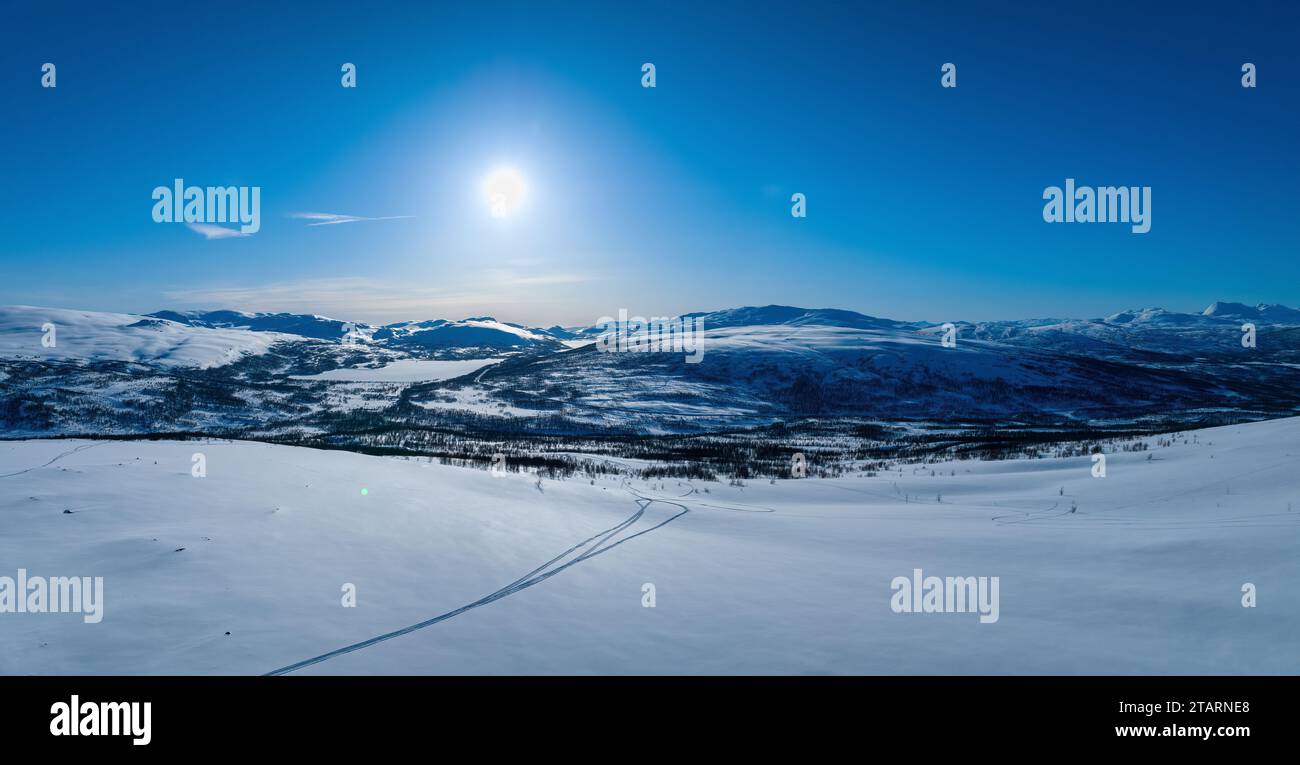 Scenic aerial winter panorama on Scandinavian Mountains at border between Sweden and Norway, sunny blue sky, cold winter day. Sweden, Joesjo Stock Photo