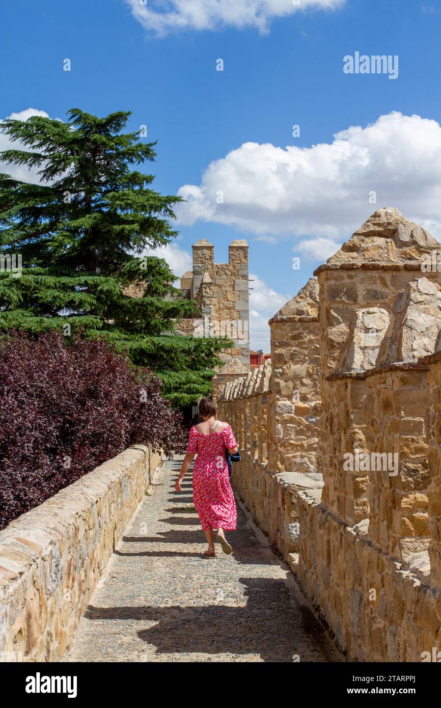 Woman walking on the ramparts of the fortified city walls in the