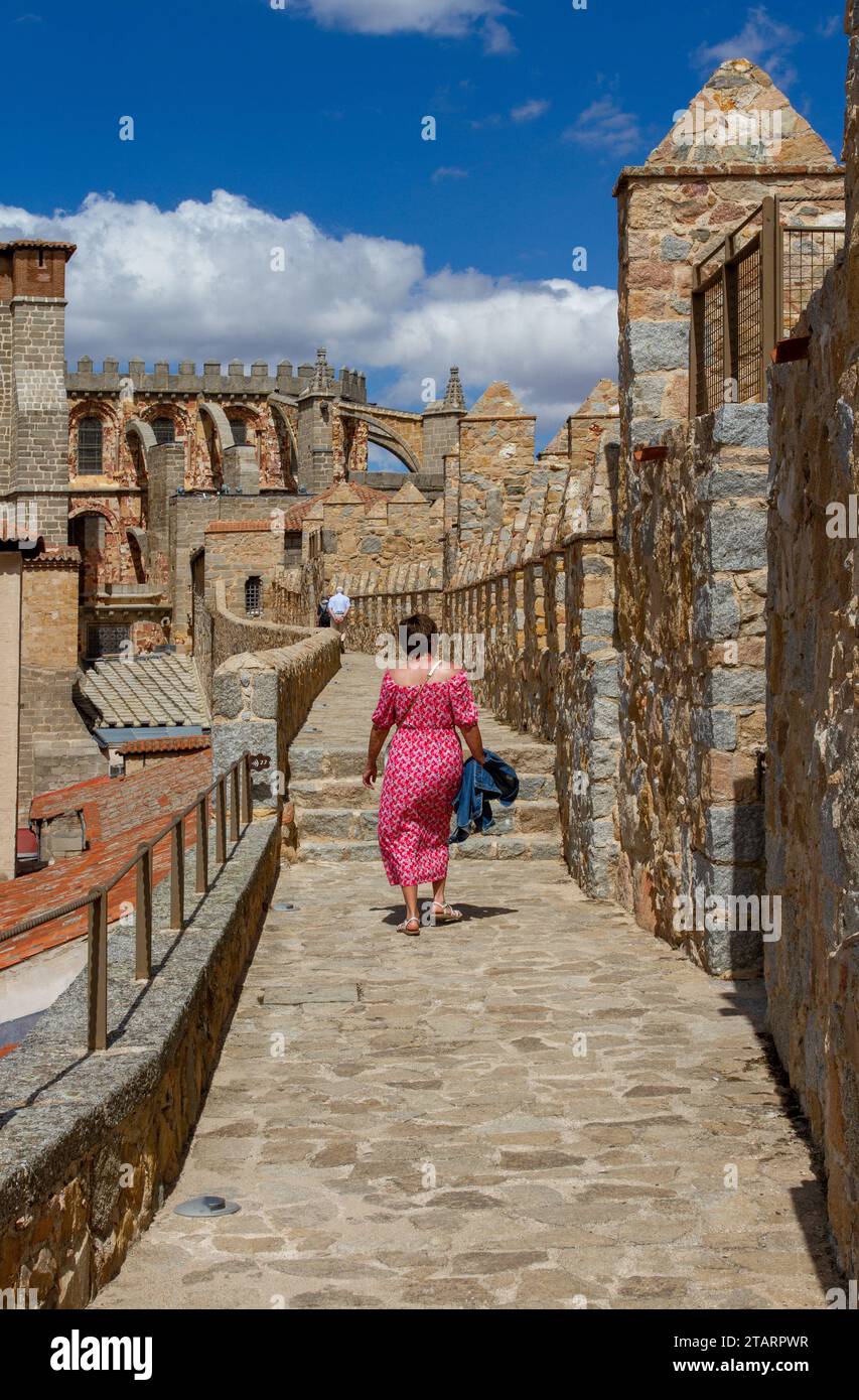 Woman walking on the ramparts of the fortified city walls in the