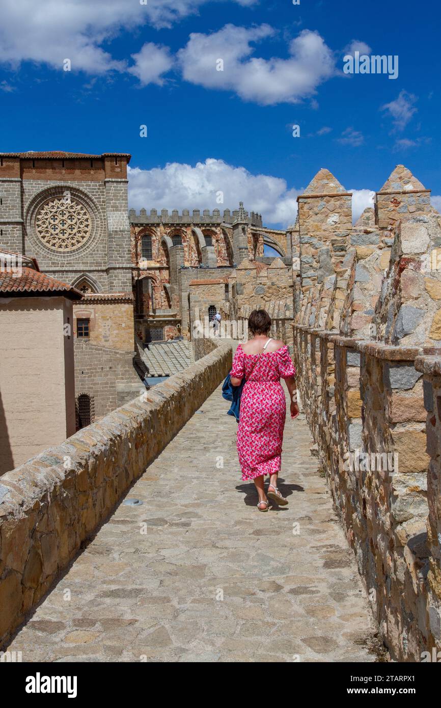 Woman walking on the ramparts of the fortified city walls in the