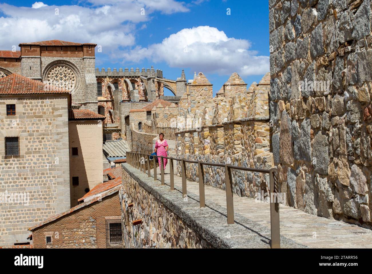 Woman walking on the ramparts of the fortified city walls in the