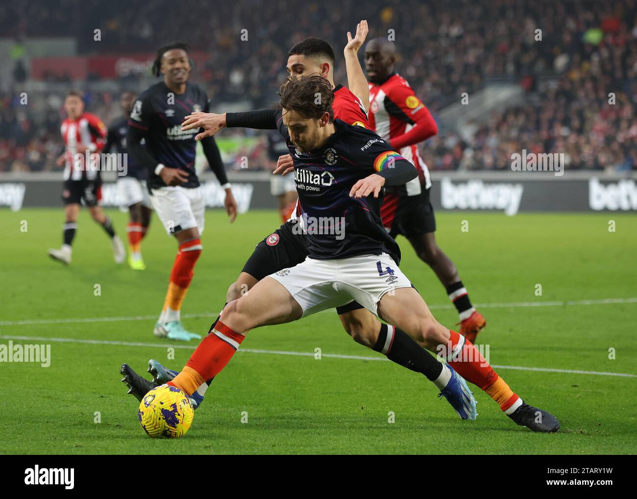 London, UK. 2nd Dec, 2023. Tom Lockyer of Luton Town and Neal Maupay of Brentford challenge for the ball during the Premier League match at Gtech Community Stadium, London. Picture credit should read: Paul Terry/Sportimage Credit: Sportimage Ltd/Alamy Live News Stock Photo