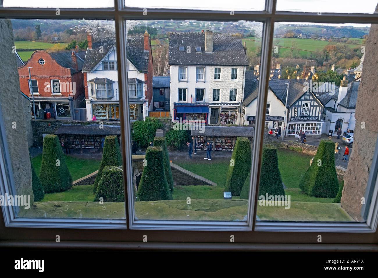 View of the book town town shops and street outside from inside Hay Castle looking through window Hay-on-Wye Wales UK Great Britain   KATHY DEWITT Stock Photo