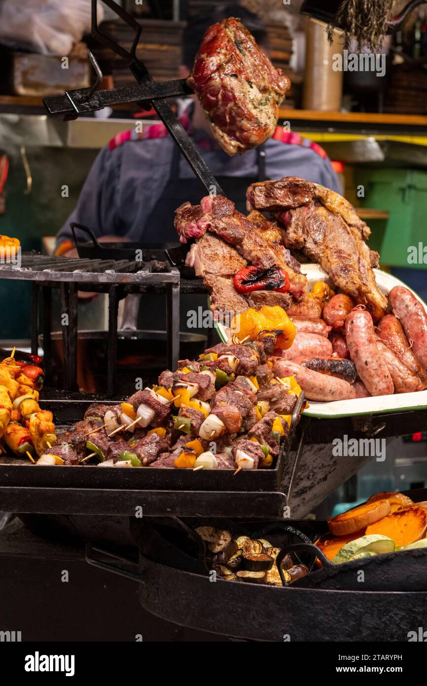 Argentina, Buenos Aires, San Telmo Market. Local cafe serving traditional Argentinean BBQ. Stock Photo