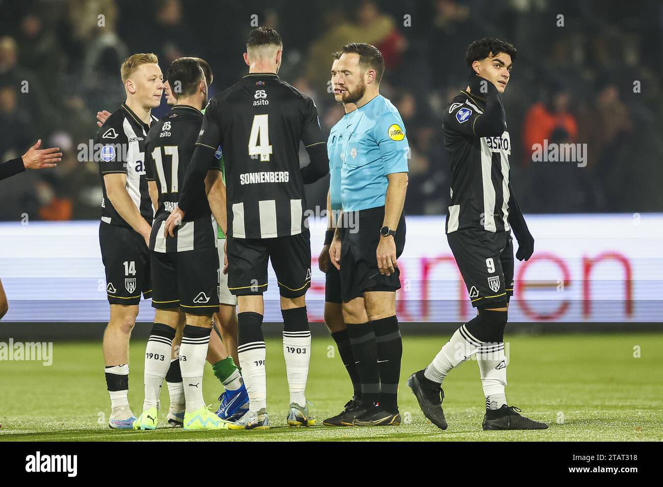 ALMELO - Brian de Keersmaecker of Heracles Almelo, Thomas Bruns of Heracles Almelo, Sven Sonnenberg of Heracles Almelo, Antonio Satriano of Heracles Almelo (lr) react after the 0-1 loss during the Dutch Eredivisie match between Heracles Almelo and Sparta Rotterdam in the Erve Asito stadium on December 2, 2023 in Almelo, Netherlands. ANP VINCENT JANNINK Stock Photo