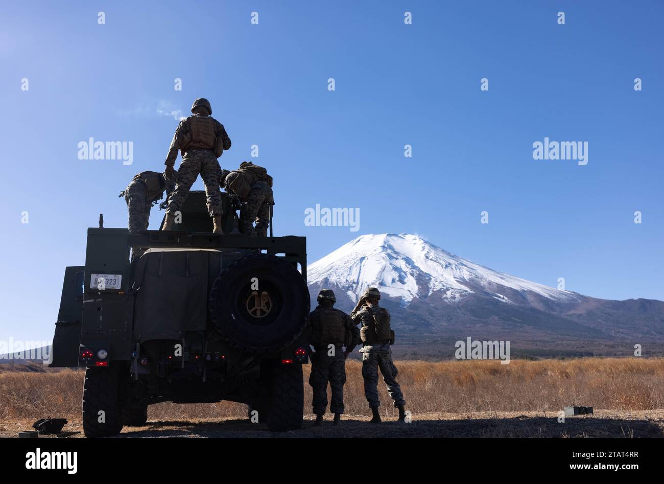 U.S. Marines execute a joint light tactical vehicle mounted M240B ...