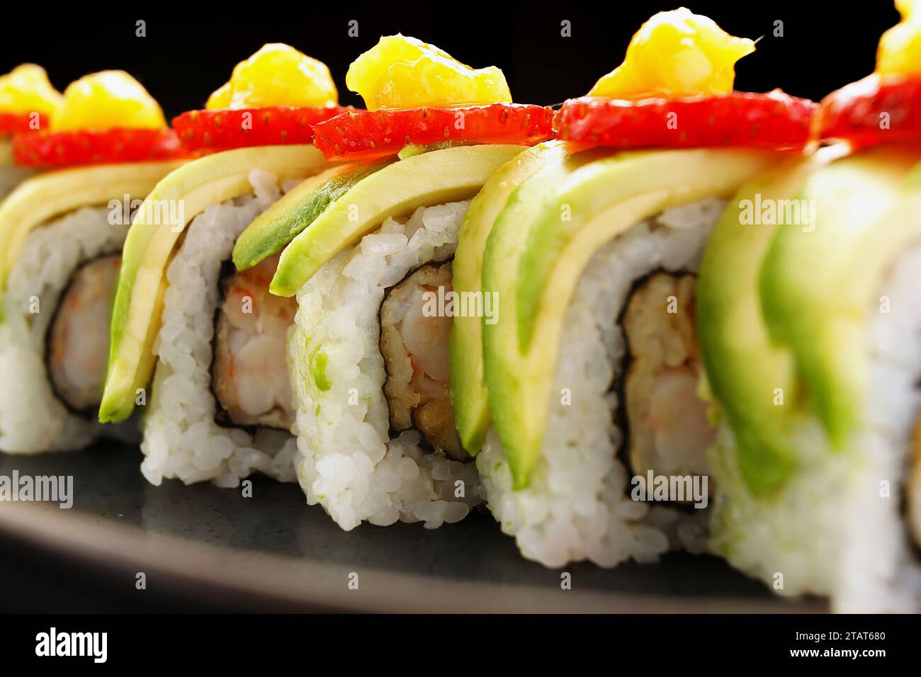 avocado and shrimp sushi roll with a hint of strawberry Stock Photo