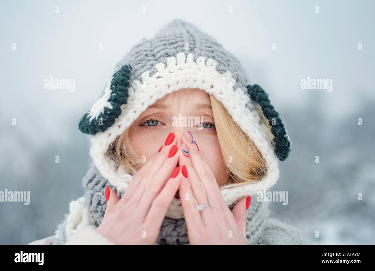 Woman with winter allergy symptoms blowing nose. Portrait Of Young