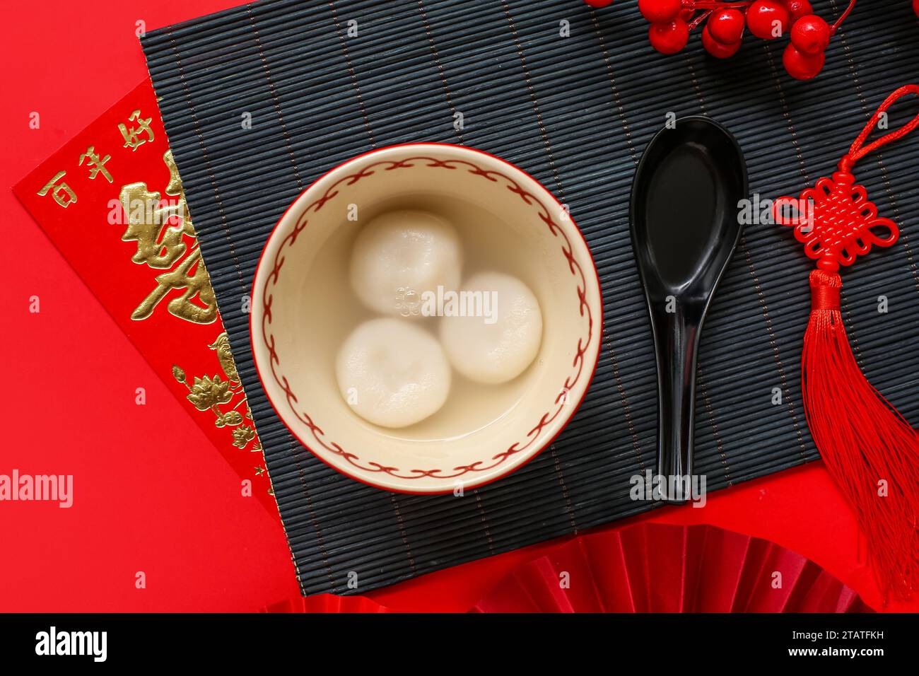 Bowl of tangyuan and Chinese decor on red background. Dongzhi Festival ...