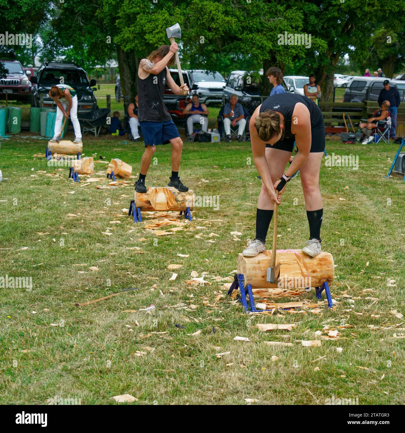 Marchwood Park, Motueka, Tasman District, Aotearoa / New Zealand – December 2, 2023: Axemen and axewomen in a wood chopping competition at the Motueka Stock Photo