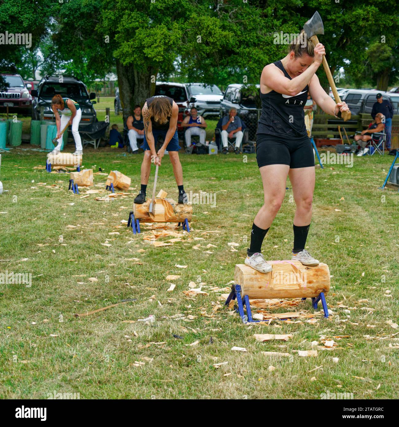 Marchwood Park, Motueka, Tasman District, Aotearoa / New Zealand – December 2, 2023: Men and women in a axe wood chopping competition at the Motueka A Stock Photo