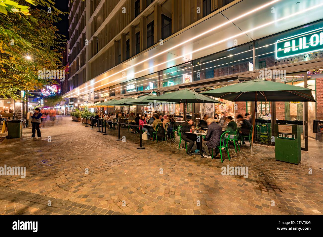Outdoor or alfresco dining at Lilong Chinese restaurant at Darling Quarter in Sydney, Australia at night in mid winter Stock Photo