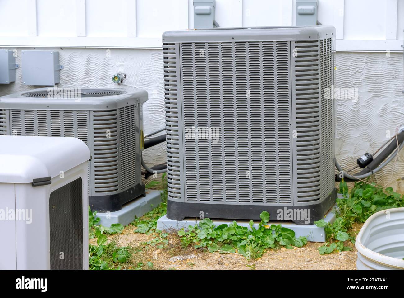 An outdoor air conditioning system is installed on facade of new house