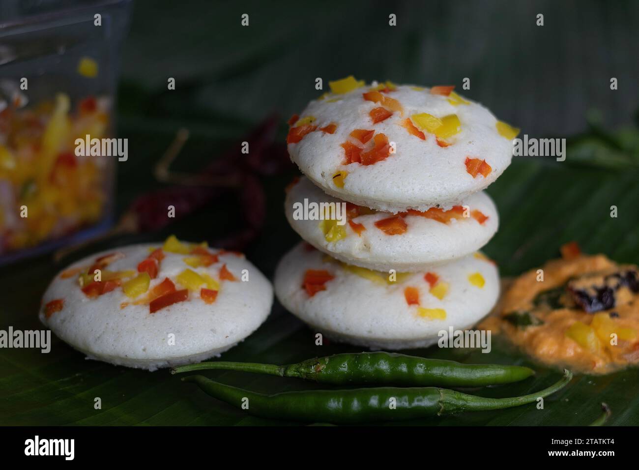 Savory bell pepper idly served on plantain leaf. A colorful and ...
