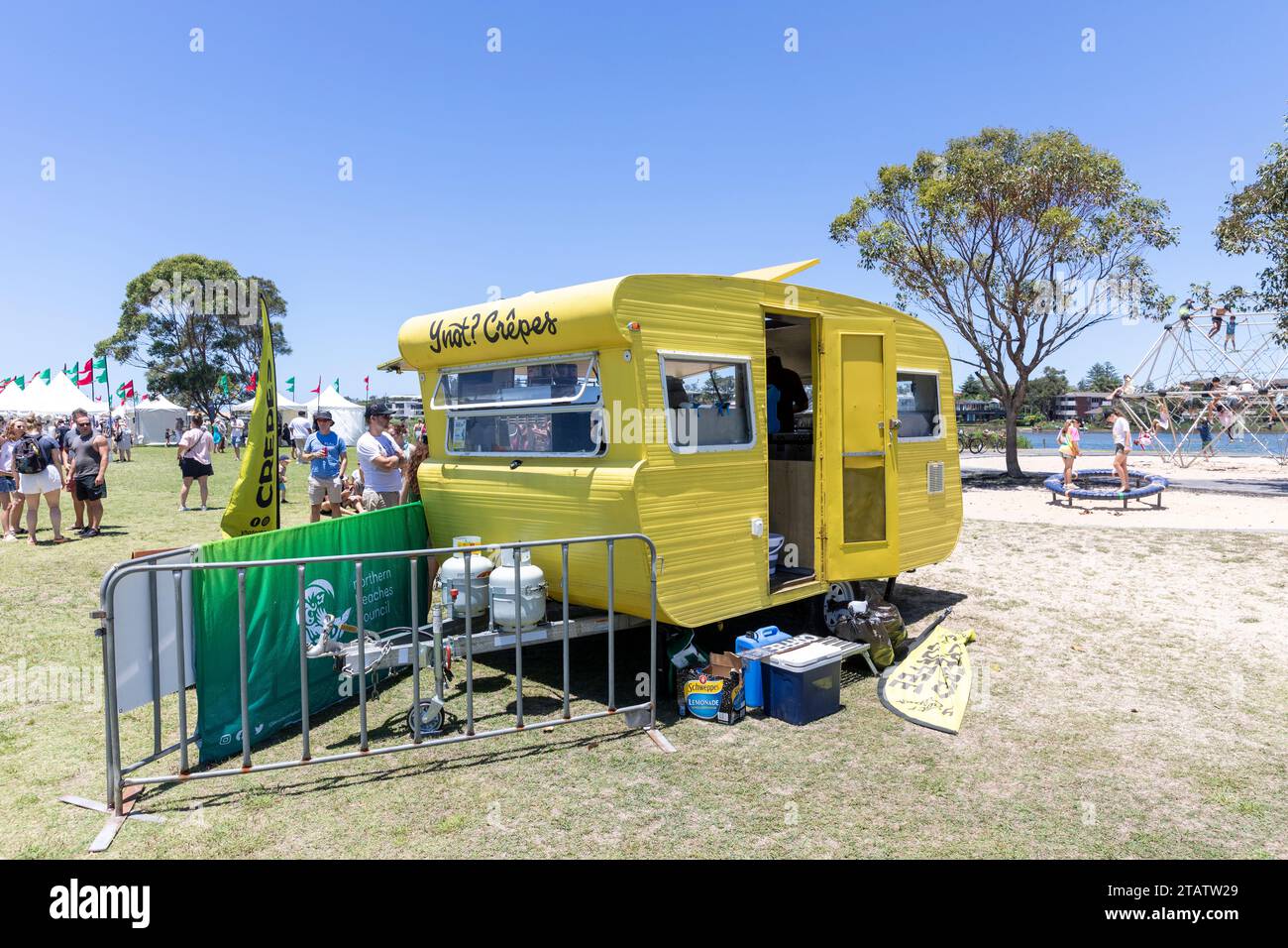 Australia Christmas market in Narrabeen Sydney, yellow caravan cooking