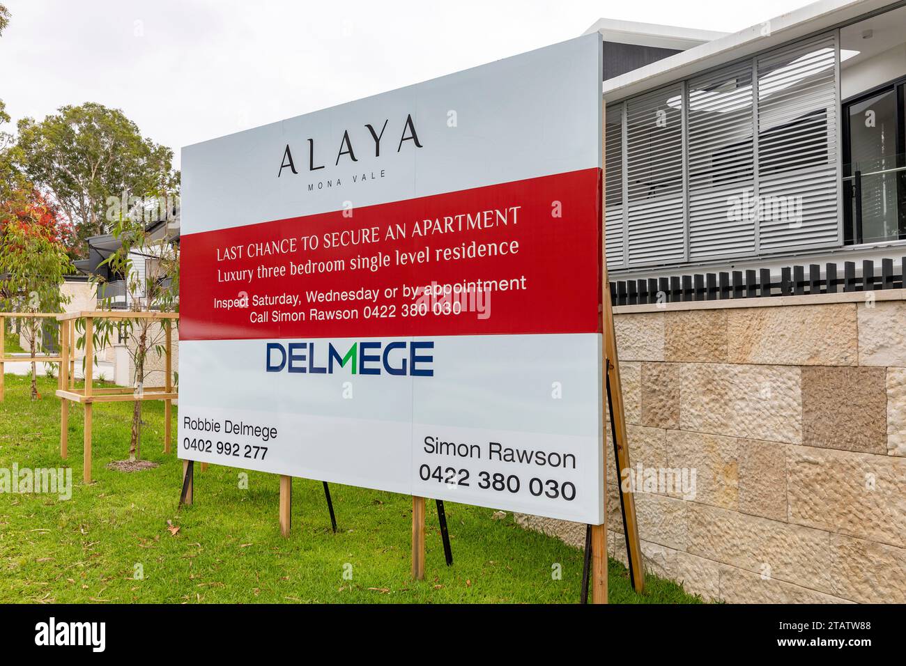 New apartments units built in Mona Vale Sydney, agent Deluge with large marketing board promoting last chance to buy apartment unit,Sydney,Australia Stock Photo