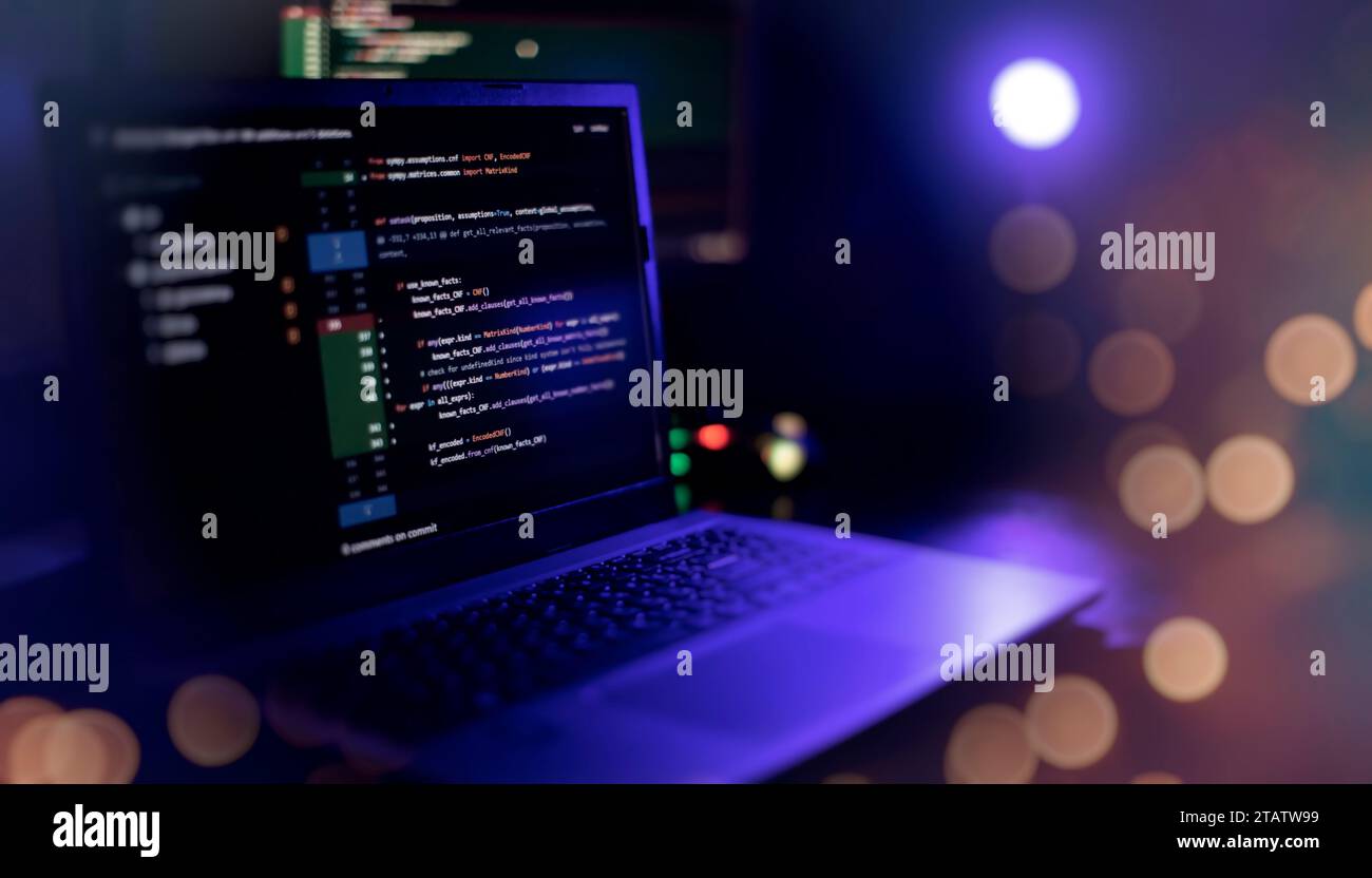 IT specialist workplace. Computer code data. Project managers Stock Photo