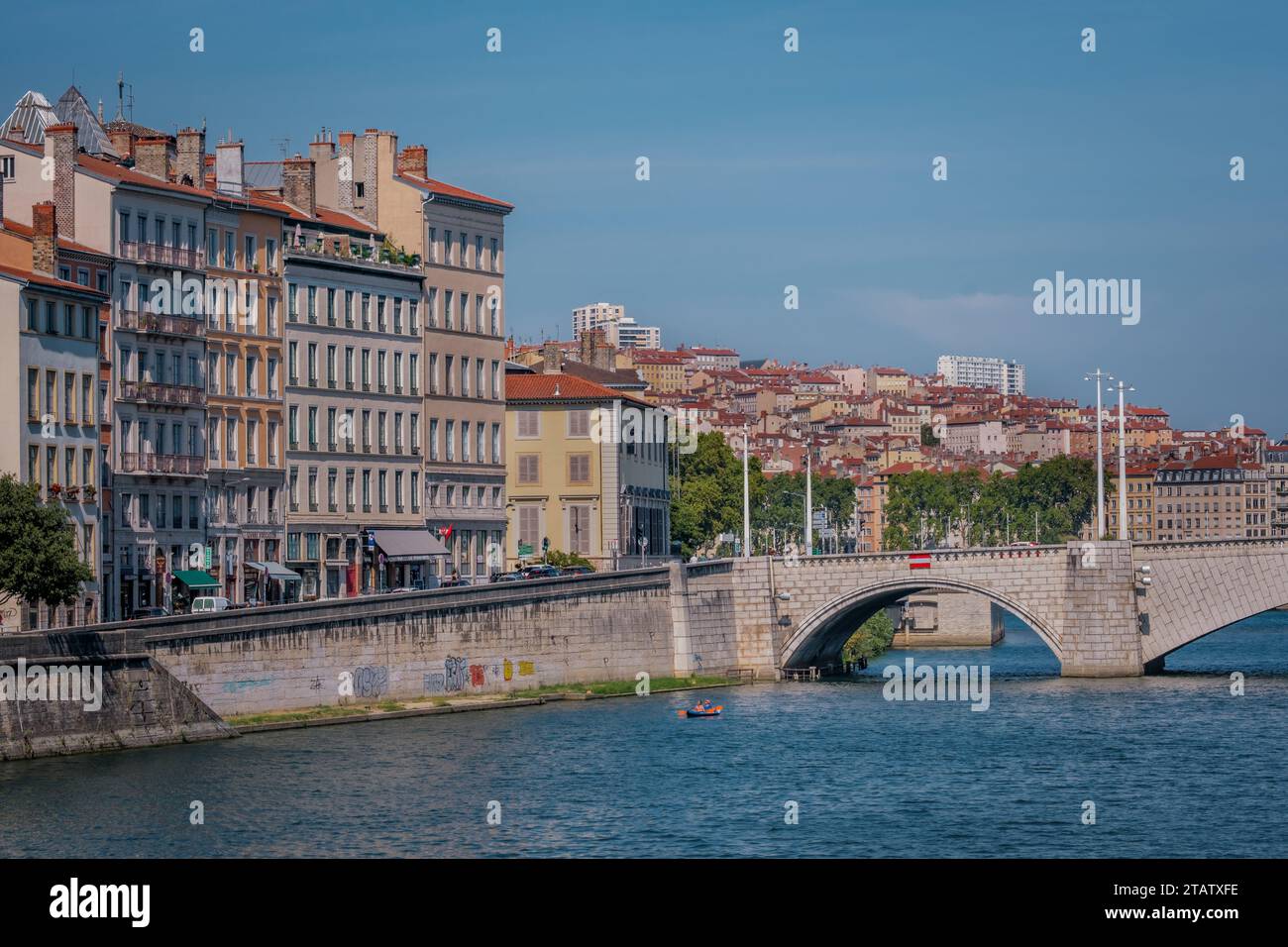 View on the Saone river quays, the Bonaparte bridge and the Croix Rousse hill in the old town of Lyon (France) Stock Photo