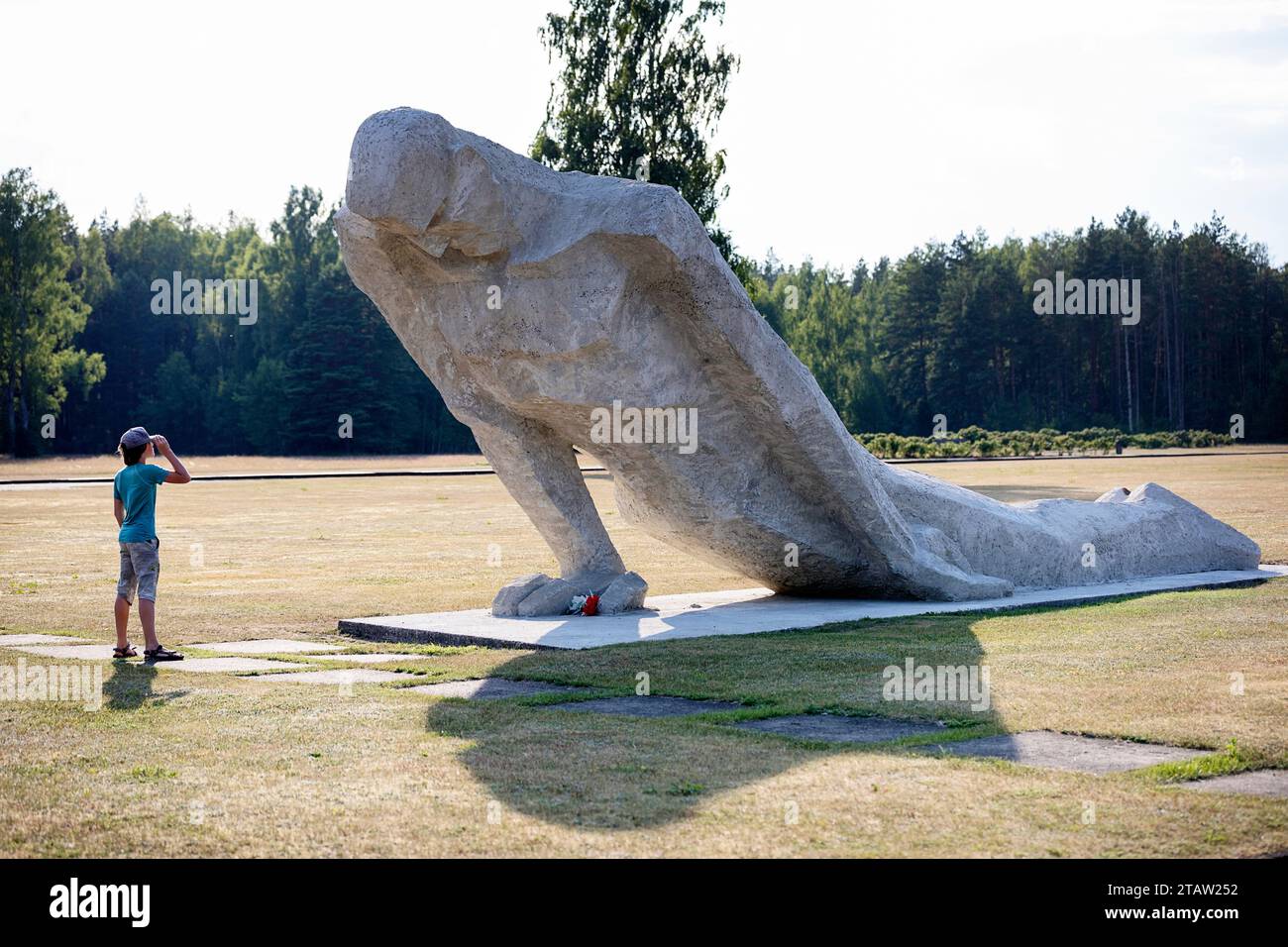 Tourist looking at the giant sculpture at Salaspils Memorial, one of Europe's largest monument complexes commemorating victims of Nazism, Latvia Stock Photo