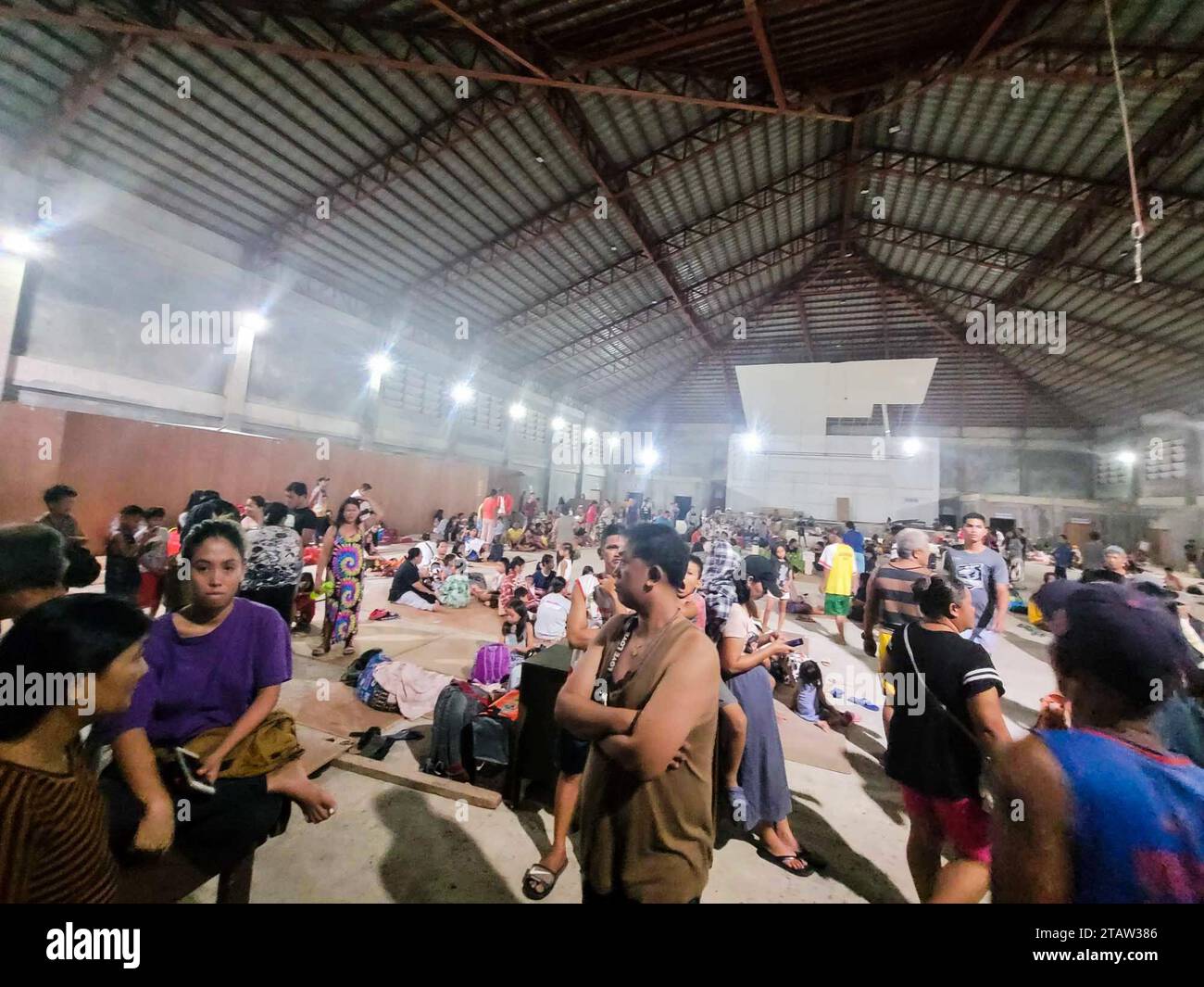Surigao Del Sur. 3rd Dec, 2023. Residents take shelter inside an evacuation center after an earthquake struck Surigao del Sur province, the Philippines on Dec. 3, 2023. A 7.4-magnitude offshore earthquake that hit southern Philippines late Saturday night has killed at least one and injured two others, local authorities reported Sunday. Credit: Xinhua/Alamy Live News Stock Photo