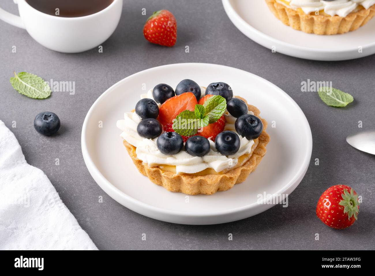 Creamy cheesecake cake with blueberry and strawberries Stock Photo - Alamy