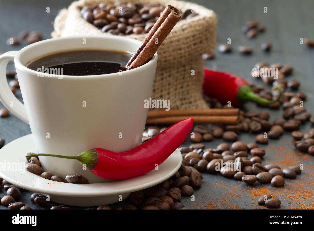Spicy coffee with chili pepper and cinnamon Stock Photo Alamy