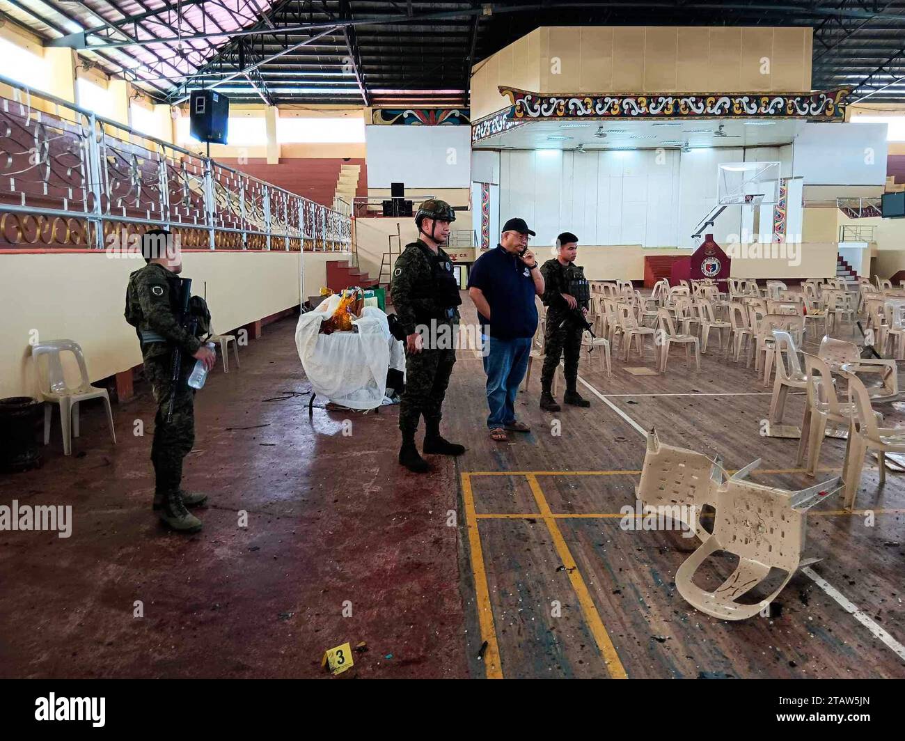 Marawi. 3rd Dec, 2023. Police investigators and soldiers are seen at the site of an explosion in Marawi City, Lanao del Sur province, the Philippines on Dec. 3, 2023. At least four were killed and 50 injured in an explosion inside a gym of Mindanao State University in the Philippines' southern province of Lanao del Sur on Sunday morning, local military and police said. Credit: Xinhua/Alamy Live News Stock Photo