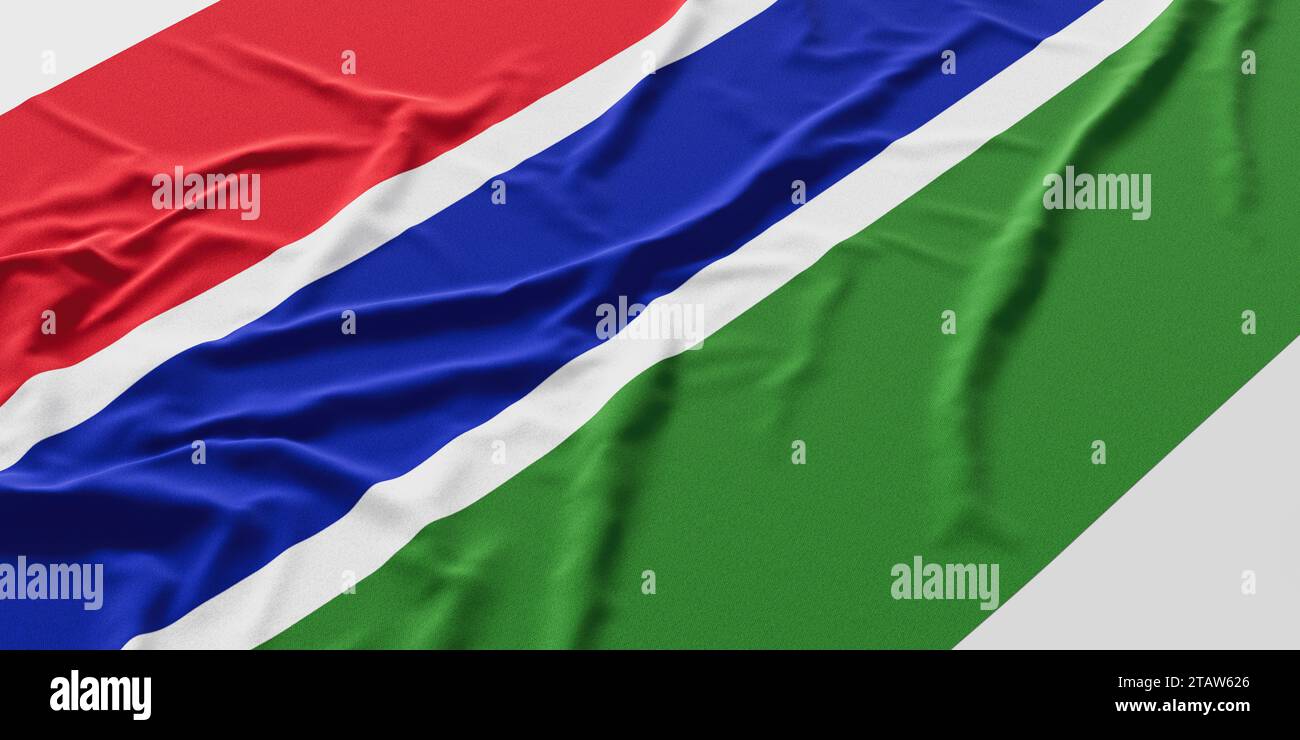 Flag of Gambia. Fabric textured Gambia flag isolated on white background. Stock Photo